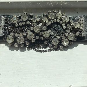 Black studded bracelet.